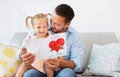 Little daughter congratulating dad with father`s day Royalty Free Stock Photo