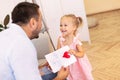 Little daughter congratulating dad with father`s day Royalty Free Stock Photo