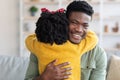 Little Daughter Embracing Happy Young African American Father At Home Royalty Free Stock Photo