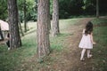 Little daughter and her father having fun in forest Royalty Free Stock Photo