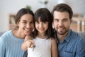 Little daughter holding keys happy family buy new home Royalty Free Stock Photo