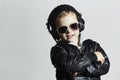 Little deejay. funny smiling boy in sunglasses and headphones Royalty Free Stock Photo