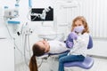 Little dentist girl gesturing thumb up