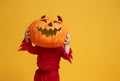 Little devil with a pumpkin Royalty Free Stock Photo