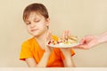 Little disaffected boy refuses to eat pasta with cutlet Royalty Free Stock Photo