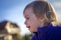 Little disheveled girl crying outdoors Royalty Free Stock Photo