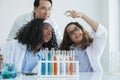 Little diversity Caucasian and African black kids learning chemistry in school laboratory Royalty Free Stock Photo