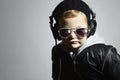 Little DJ. funny boy in sunglasses and headphones.child listening music in headphones. deejay Royalty Free Stock Photo