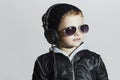 Little DJ. funny boy in sunglasses and headphones. child listening music Royalty Free Stock Photo