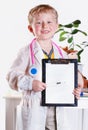 Little doctor with clip board Royalty Free Stock Photo
