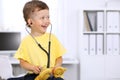 Little doctor examining a ntoy bear patient by stethoscope Royalty Free Stock Photo