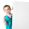 Little doctor kid behind blank banner isolated