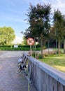 Dog in front of a no poop sign