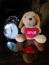 Little doggie and the tickling clock and its refelction