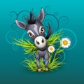 Little donkey in grass over emerald