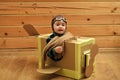 Little dreamer boy playing with a cardboard airplane Royalty Free Stock Photo