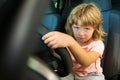 Little Driver. Cute little boy pretending to drive. Kid in car with his hands on the wheel. Child Driver. Little kid Royalty Free Stock Photo