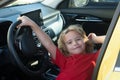 Little Driver. Cute little boy pretending to drive. Kid in car with his hands on the wheel. Child Driver. Little kid Royalty Free Stock Photo