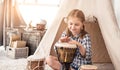 Little drummer girl playing on djembe Royalty Free Stock Photo