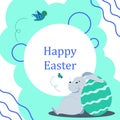 a little easter bunny sits leaning on an egg and wishes everyone a happy easter Royalty Free Stock Photo