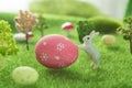 Little Easter bunny toys and Easter eggs on green grass. Fairy tale Royalty Free Stock Photo