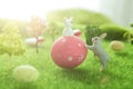 Little Easter bunny toys and Easter eggs on green grass. Fairy tale Royalty Free Stock Photo