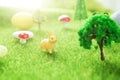 Little Easter bunny toys and Easter eggs on green grass. Fairy tale Royalty Free Stock Photo