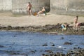 Little egret Egretta garzetta and people in the background.