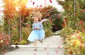 Little elf girl in a blue dress with wings on the run in the park Royalty Free Stock Photo