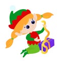 Little elf girl unpacks a Christmas present. The child is dressed in a traditional red and green costume. Royalty Free Stock Photo