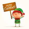 Little elf holds a wooden board with Christmas greetings. Isolated. Royalty Free Stock Photo