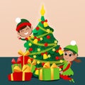 The little elves are near the Christmas tree with gift boxes. The mood of celebration and delight. Royalty Free Stock Photo