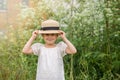 Little emotional Girl in a white boho dress with a hat smiling playing Royalty Free Stock Photo