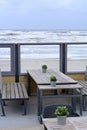 Little empty restaurant near the beach. Sea view from the cafe`s balcony. Empty cafe Royalty Free Stock Photo
