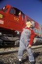 A little engineer in engineer cap with a historic Santa Fe Diesel train in Los Angeles, CA