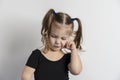 Little european girl on a light background