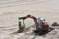 Little excavator in the sand