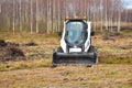 Little excavator. Tractor with a bucket