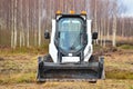 Little excavator. Tractor with a bucket