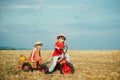 Little family farmers. Eco farm for kids. Children farmers in the farm with countryside background. Springtime on the Royalty Free Stock Photo