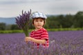 Little fashionable boy having fun in lavender field