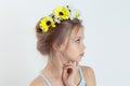 Little fashionista in profile. Closeup portrait serious little Girl thinking daydreaming having idea hand on chin in wreath of