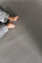 Little feet of newborn baby with copy space on gray background Royalty Free Stock Photo