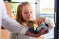 little female child paying with credit card