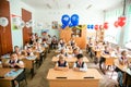 Little first-grader, girl-student goes to school on knowledge day - September First. Student of elementary school in uniform with