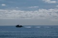 little fishing boat crossing the calm sea Royalty Free Stock Photo