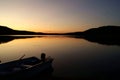 Little fishing boat on a wild lake in the Canadian forest