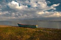 Little fishing boats with flaking paint on the beach in the Song