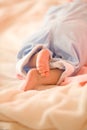 Little foot of sleeping newborn infant