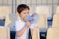 Little football fan with megaphone Royalty Free Stock Photo